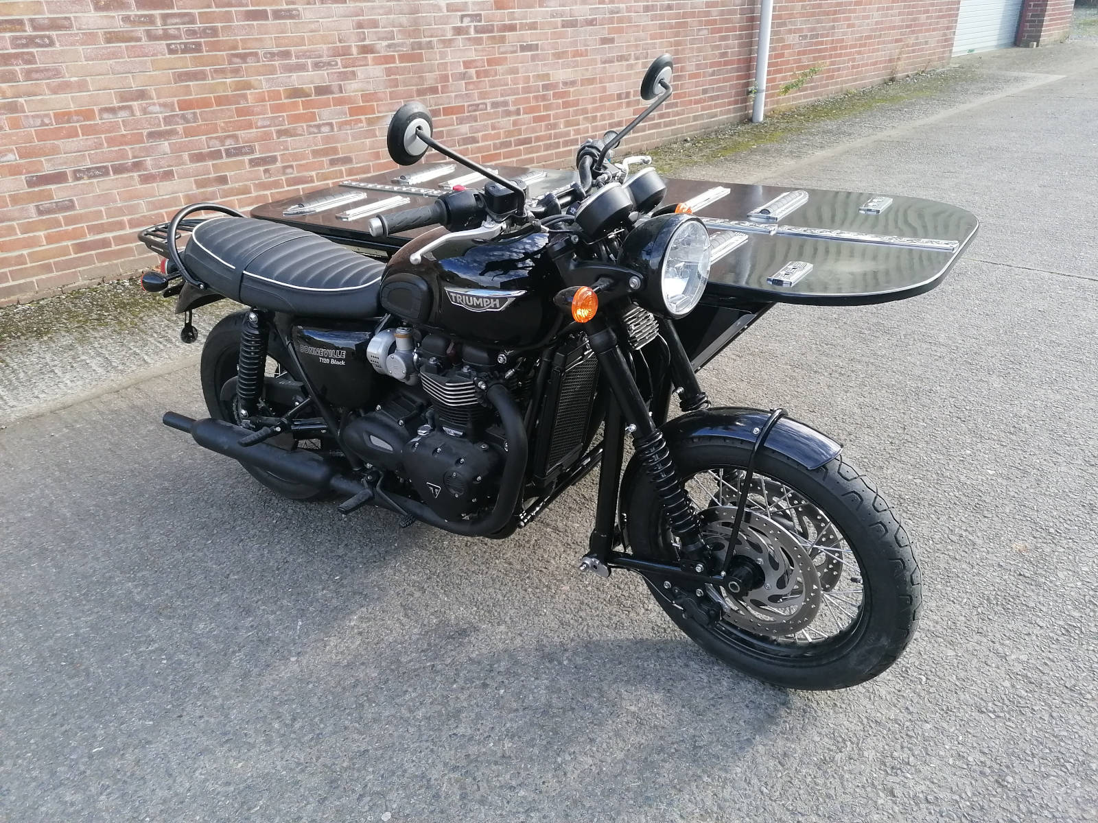 Image linking to the Triumph Bonneville Hearse Outfit page for details of  and the  on offer there: Follow the project to build a one-off hearse sidecar fitted to a Triumph Bonneville.