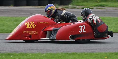 Image linking to the Ricky Lumley - #32 page for details of  and the  on offer there: Ricky races F2 sidecar outfit number 32 in the Bemsee (British Motorcycle Racing Club) championship.